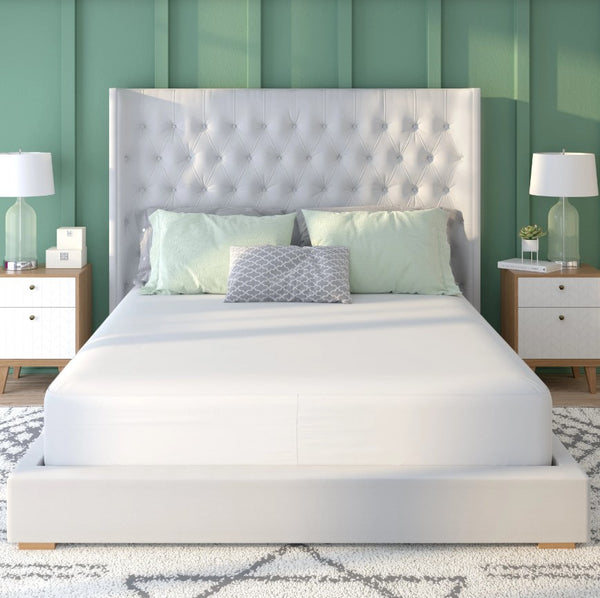Front Centered View Of The Rize Home Tencel Mattress Protector On Bed In Bedroom With A Bed Featuring A Tufted Headboard Green Walls And White Nightstands 
