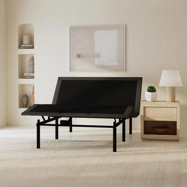 Front Centered View Of The Rize Tranquility II Adjustable Bed Shown In The Leg And Head Articulated Position In A Room With A Lamp And Shelves