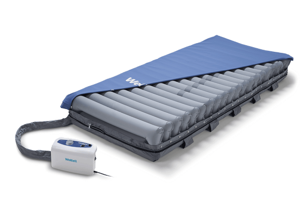 Front Centered View Of The Wellell Domus 3 Alternating Pressure Redistribution Mattress System With Quilted Cover Shown With Control Unit And Cover Slightly Removed