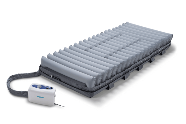 Front Centered View Of The Wellell Domus 3 Alternating Pressure Redistribution Mattress System With Quilted Cover Shown With Control Unit And Without The Cover