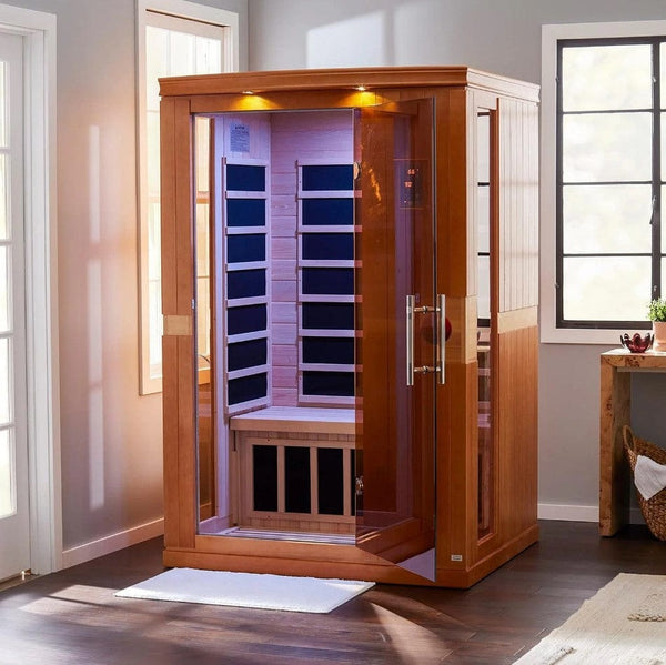 Front Left Side View Of The Dynamic Venice 2-Person Low EMF FAR Infrared Indoor Sauna | DYN-6210-01 Shown With Door Ajar In An Indoor Setting With Overhead Light On