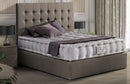 Front Left Side View Of The Eurolux Prive: The 10-Layer Luxury Mattress Crafted By Masters Shown On A Gray Bed Frame In A Bedroom Setting