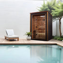 Front Left Side View Of The Golden Designs Narvik 2-Person Outdoor Sauna | GDI-8202-01 Shown In A Backyard Setting Next To A Pool