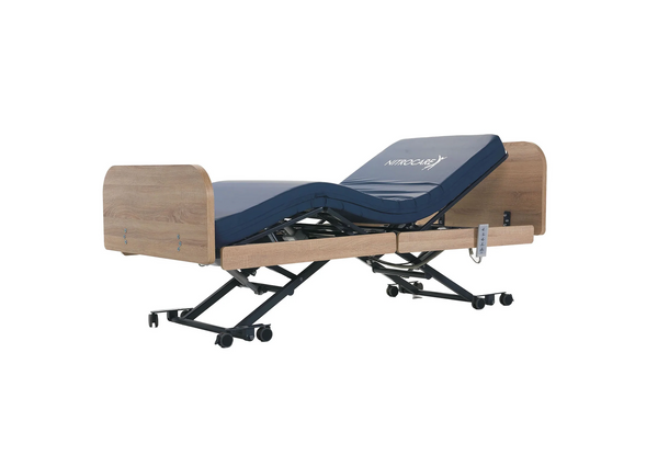 Front Left Side View Of The Nitrocare Miranda 7410 Hi Low Adjustable Bed In The Raised Position With The Head And Leg Portion In The Articulated Position