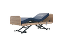Front Left Side View Of The Nitrocare Miranda 7410 Hi Low Adjustable Bed In The Raised Position With The Head And Leg Portion In The Articulated Position