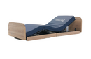 Front Left Side View Of The Nitrocare Miranda 7410 Hi Low Adjustable Bed Shown With The Leg And Head Portion In The Articulated Position
