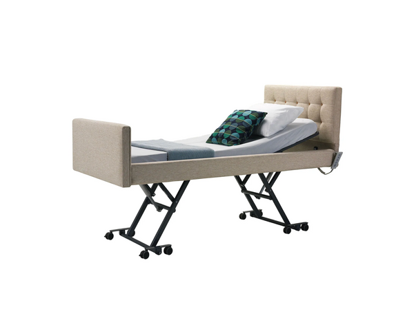 Front Left Side View Of The Nitrocare Miranda Hi Low Adjustable Bed With Bedding Shown In The Raised Position With The Head Portion Of The Frame In The Slightly Raised Position