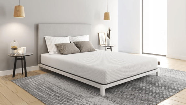 Front Left Side View Of The Skyward Medical Mira 8" Firm Memory Foam Mattress On A Bedframe In An Indoor Bedroom Setting