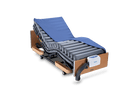 Front Left Side View Of The Wellell Domus Auto Pressure Redistribution Mattress System With Quilted Cover Shown On An Adjustable Hospital Bed In The Upright Position