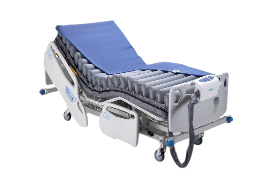 Front Right Side View Of An Adjustable Hospital Bed With The Wellell Domus Auto: Automatic Pressure Redistribution Mattress System On It With The Control Unit Hanging On The Footboard