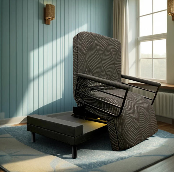 Front Right Side View Of The Customatic Sleep Technologies Independence Rotating Bed In The Chair Position Shown In A Bedroom Setting Next To A Window