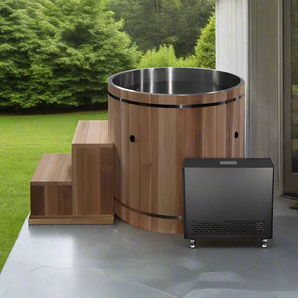 Front Right Side View Of The Dynamic Cedar Cold Plunge Barrel Shown With Steps, Stainless Steel Interior Material, And Chiller In An Outdoor Setting