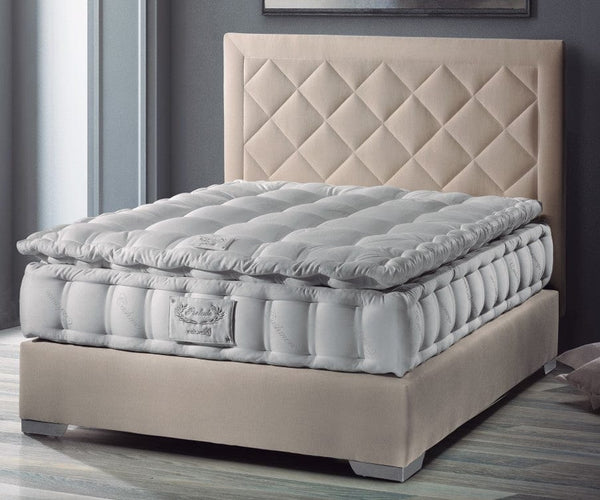 Front Right Side View Of The Eurolux Natur: The 6-Layer Luxury Mattress Crafted By Masters Shown On A Beige Bed Frame In A Bedroom Setting