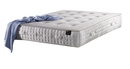Front Right Side View Of The Eurolux Natur: The 6-Layer Luxury Mattress Crafted By Masters Shown With A Blue Blanket Hanging Off The Corner