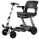 Front Right Side View Of The FreeRiderUSA Luggie Super Plus 4 Folding Mobility Scooter Shown In The Mineral Gray Color