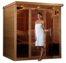Front Right Side View Of The Golden Designs Monaco 6-Person Near Zero EMF Indoor Sauna | GDI-6996-01 Shown With A Young Woman Standing In Front Of The Sauna