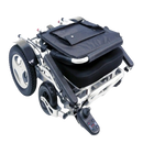 Front Right Side View Of The Karman Tranzit-Go Electric Wheelchair In The Folding Position