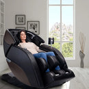 Front Right Side View Of The Kyota Nokori M980 Massage Chair Shown With A Woman Sitting In The Chair In An Indoor Setting