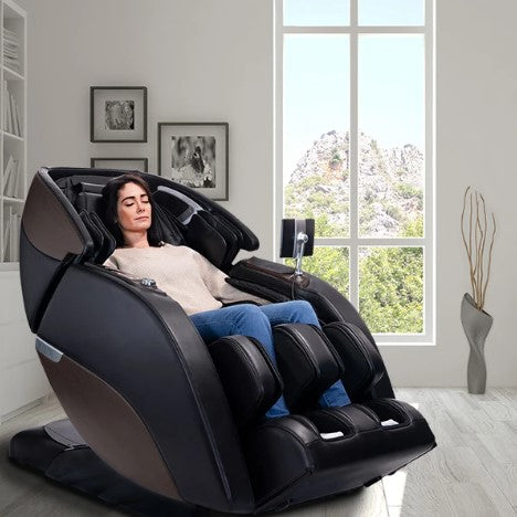 Front Right Side View Of The Kyota Nokori M980 Massage Chair Shown With A Woman Sitting In The Chair In An Indoor Setting