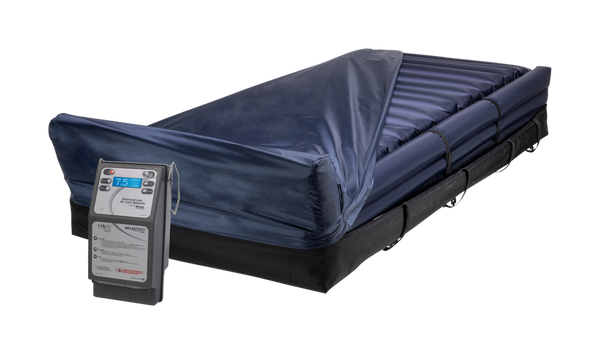 Front Right Side View Of The Moxi SelectAir Standard Mattress System With Foot Pillow Shown With Control Unit Attached And Cover Slightly Removed