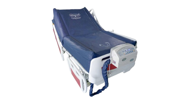 Front Right Side View Of The ObboMed OB-2600 Advanced Low Air Loss Alternating Pressure Mattress Shown In The Chair Position