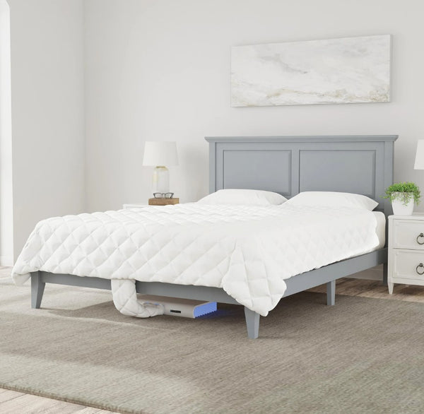 Front Right Side View Of The Rize Home Smart Duvet With Blue Light Color On Gray Bedframe Shown In A Bedroom Setting