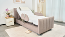 Front Right Side View Of The StarSleep Arlo Rotating Bed In The Head Elevated Position With Optional Foam Pillow Shown In A Bedroom Setting