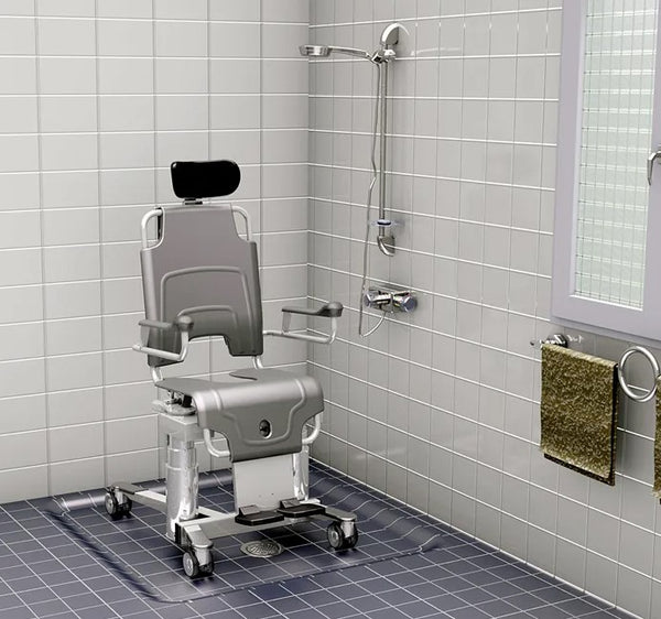 Front Right Side View Of The TR Equipment TR1000 Battery Operated Shower Chair Shown In A Bathroom Setting