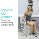 Front Right Side View Of The Vive Health Stand Alone Toilet Rail Placed Next To A Toilet Bowl With A Woman Using The Railing For Balance Assistance In A Bathroom Setting Demonstrating Its Stabilizing Support