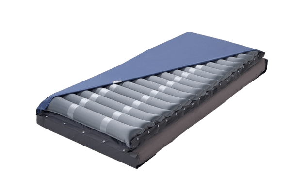 Front Right Side View Of The Wellell Domus 2 Alternating Pressure Redistribution Mattress Shown Without Control Unit With Cover Slightly Removed