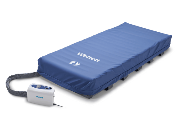 Front Right Side View Of The Wellell Domus 3 Alternating Pressure Redistribution Mattress System With Quilted Cover Shown With Control Unit