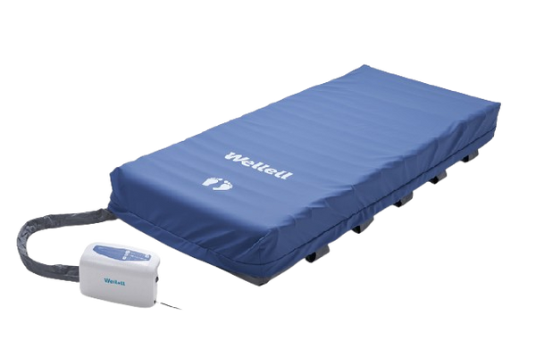Front Right Side View Of The Wellell Domus Auto Pressure Redistribution Mattress System With Quilted Cover Shown With Cover Covering Top Of Mattress