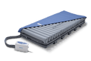 Front Right Side View Of The Wellell Domus Auto Pressure Redistribution Mattress System With Quilted Cover Shown With Cover Slightly Removed