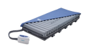 Front Right Side View Of The Wellell Domus Auto: Automatic Pressure Redistribution Mattress System Shown With Control Unit And Cover Slightly Removed