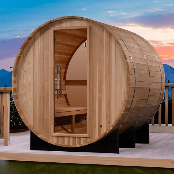 Front Right View Of The Golden Designs Zurich 4-Person Barrel Sauna | GDI-B024-01 Shown In An Outdoor Setting With Mountains In The Background