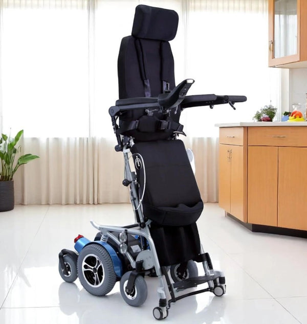 Front Right View Of The Karman XO-505 Power Standing Wheelchair In The Upright Position Shown In A Clinical Setting