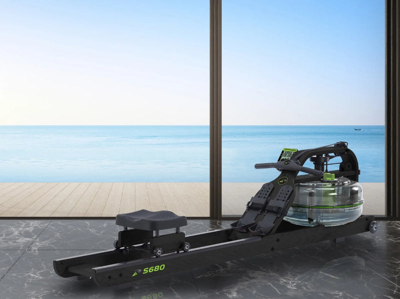 Front View Of The Dynamic Fluid Fitness S680 Rower In A Home Setting With Ocean In The Background