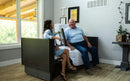 Front View Of The Med Mizer Active Care Deluxe Rotating Bed And Bed In The Chair Position In A Home Setting With An Elderly Man And Young Woman Sitting Laughing In The Bed 