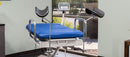 Front View Of The Med Mizer UpScale Adjustable Treatment Table With Scale And Stirrups Attachment In Clinical Setting