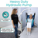 Front View Of The Vive Health Hydraulic Patient Lift With Sling With A Woman Being Transferred From The Sling To A Bed With Text 'Heavy Duty Hydraulic Pump'