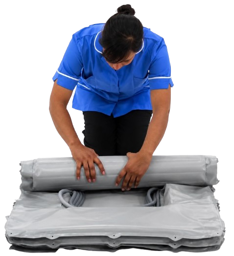Healthcare Worker Rolling The Winncare Mangar Camel 