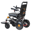 Left Side View Of The Bangeran Pegasus Kids Pediatric Electric Wheelchair Shown In Black And Orange Color