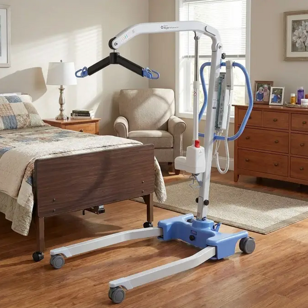 Left Side View Of The Joerns Hoyer Advance-E Portable Electric Professional Patient Lift Shown In A Bedroom Setting