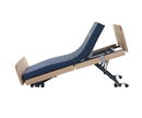 Left Side View Of The Nitrocare Miranda 7410 Hi Low Adjustable Bed Shown In The Reverse Trendelenburg Position With The Head Portion In The Articulated Position