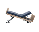 Left Side View Of The Nitrocare Miranda 7410 Hi Low Adjustable Bed Shown In The Trendelenburg Position With The Head Portion In The Articulated Position