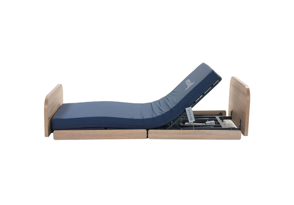 Left Side View Of The Nitrocare Miranda 7410 Hi Low Adjustable Bed With The Head Portion In The Articulated Position