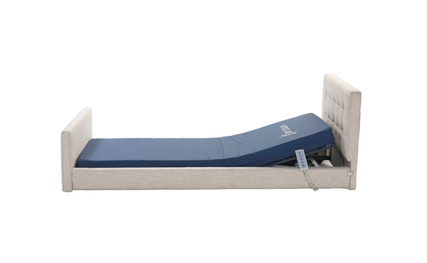 Left Side View Of The Nitrocare Miranda Hi Low Adjustable Bed Shown With The Head Portion Of The Frame Slightly Raised