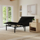 Left Side View Of The Rize Tranquility II Adjustable Bed Shown In The Leg And Head Articulated Position In A Room With A Lamp And Shelves