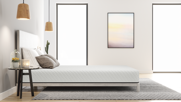 Left Side View Of The Skyward Medical Mira 8" Firm Memory Foam Mattress On A Bedframe In An Indoor Bedroom Setting