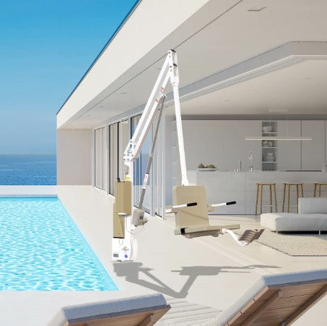 Modern Outdoor Setting With An Aqua Creek Revolution XL Deep Draft Pool Lift Tan And White Color, Lounge Chairs, And A Kitchen Area.